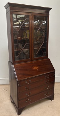 Lot 1139 - An Edwardian inlaid mahogany bureau bookcase,...