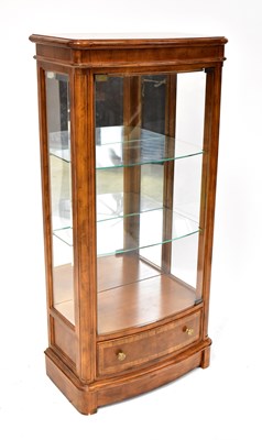 Lot 23 - A contemporary bow-fronted display cabinet...