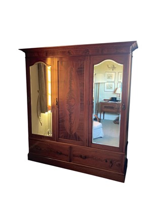 Lot 1189 - An Edwardian mahogany triple door wardrobe,...
