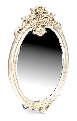 Lot 123 - A contemporary ornate silvered wall mirror...