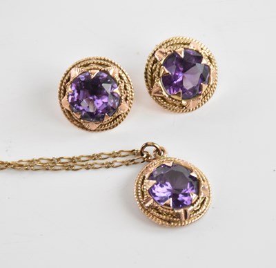 Lot 355 - A 9ct yellow gold flat link chain supporting a...