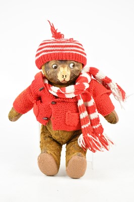 Lot 856 - A 20th century teddy bear with glass eyes,...