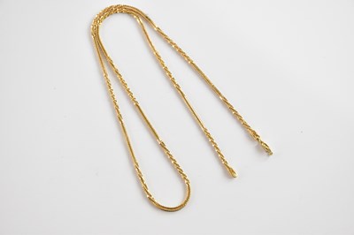 Lot 337 - A textured yellow metal chain, stamped '750',...