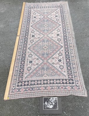Lot 1320 - A hand knotted cream ground Eastern style rug,...