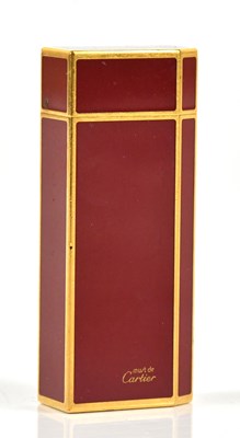 Lot 683 - CARTIER; a Must de Cartier cigarette lighter,...