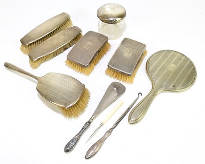 Lot 2435 - Four hallmarked silver backed brushes, with a...