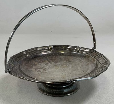 Lot 1028 - A George V hallmarked silver swing handled...