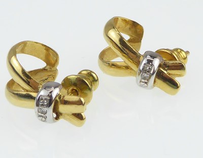 Lot 1190 - A pair of 18ct gold and diamond earrings, the...