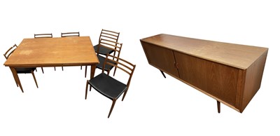 Lot 1002 - A mid century teak dining suite comprising an...