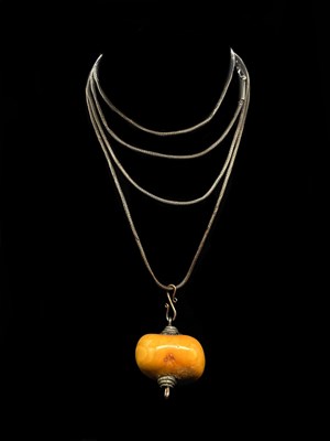 Lot 1288 - A large egg yolk/butterscotch amber bead...