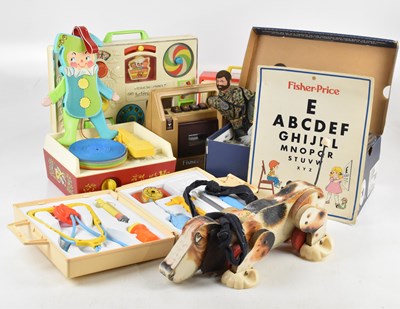 Lot 857 - A collection of vintage toys including Fisher...