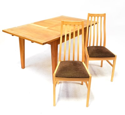 Lot 103 - A contemporary dining suite comprising an...