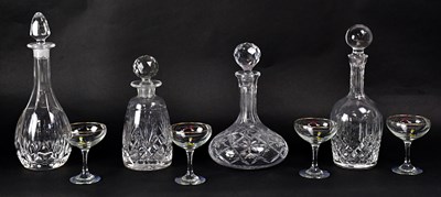 Lot 318 - Four cut and pressed glass decanters,...