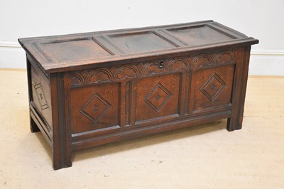 Lot 1035 - A late 18th century carved oak coffer, with...