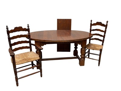 Lot 1036 - A good quality reproduction oak extending...