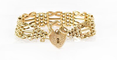Lot 835 - A 9ct gold gate link bracelet with alternating...