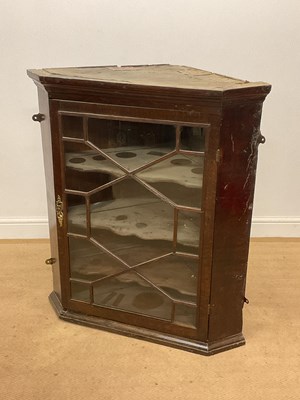 Lot 659 - A glazed oak corner cabinet with three shaped...
