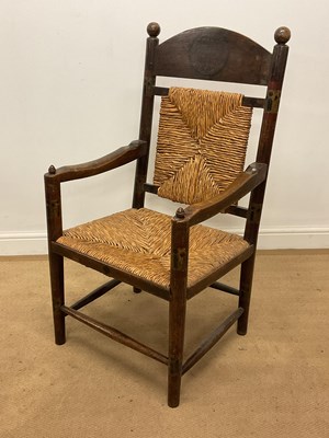 Lot 604 - An Arts and Crafts ash and beech open elbow...