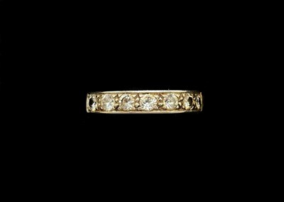 Lot 1109 - An 18ct white gold seven stone half eternity...