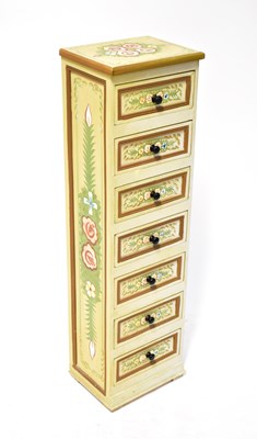 Lot 34 - A modern narrow chest of seven small drawers...