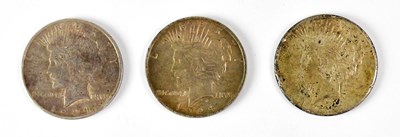 Lot 690 - Three United States 'Peace' dollars,...