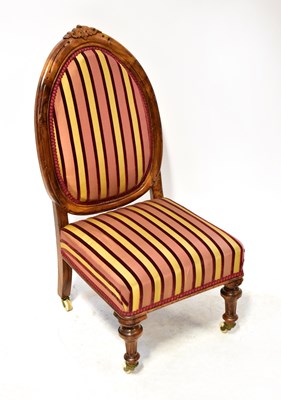 Lot 55 - A 19th century walnut nursing chair with...