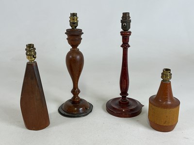 Lot 545 - Four wooden table lamps, teak and oak, largest...