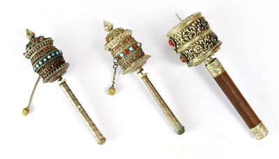 Lot 205 - A pair of Tibetan white-metal prayer wheels...