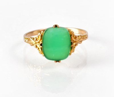 Lot 825 - A 9ct gold ring set with cabochon green stone...