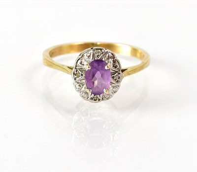Lot 824 - A 9ct gold ring set with an oval amethyst in a...