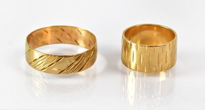 Lot 829 - Two 9ct gold wedding bands, one with engraved...