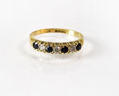 Lot 822 - A 9ct gold half eternity ring set with...