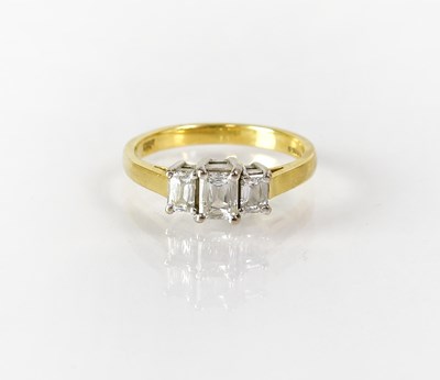 Lot 819 - An 18ct gold ring set with three baguette cut...