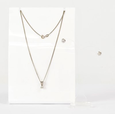 Lot 814 - A white metal pendant and diamond earring set,...