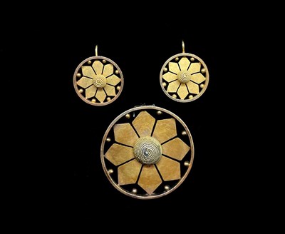Lot 1245 - A yellow metal pierced flower head brooch,...