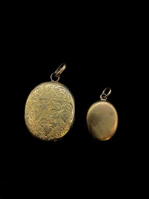 Lot 1248 - Two Edwardian oval yellow metal lockets, one...