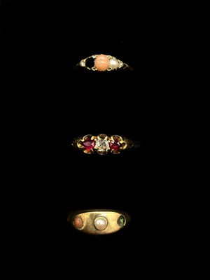 Lot 1254 - A yellow metal cabochon bead set ring (one...
