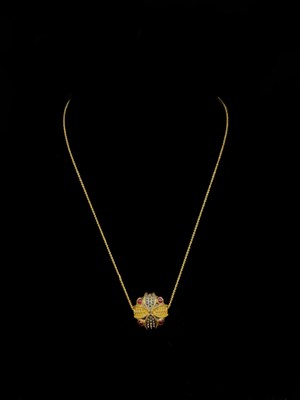 Lot 1116 - A silver gilt diamond, ruby and emerald double...