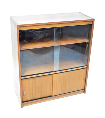 Lot 69 - A mid-20th century glazed bookcase, above...