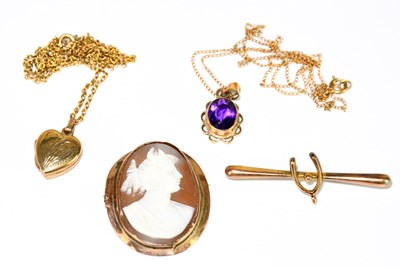 Lot 1386 - A yellow metal pendant set with an amethyst on...