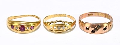 Lot 1163 - Two 18ct gold gem set dress rings, gross...