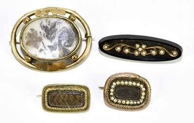 Lot 1438 - A group of four 19th century yellow metal...