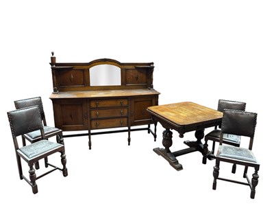 Lot 1163 - A 1920s oak dining suite, comprising draw-leaf...