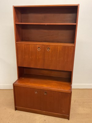 Lot 632 - A teak wall unit, with two sets of cupboard...
