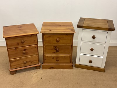 Lot 670 - Three bedside tables each with three drawers,...