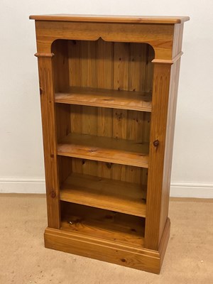 Lot 671 - A pine open bookcase with three shelves,...