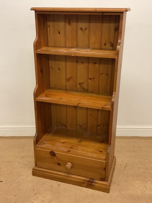 Lot 673 - A pine waterfall bookcase with two shelves and...
