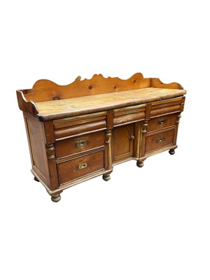 Lot 1030 - A 19th century pine sideboard with raised back...