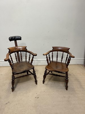 Lot 1034 - Two 19th century elm seated smokers bow back...
