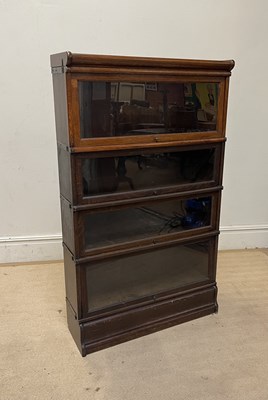 Lot 1131 - A Globe Wernicke style metal bound four tier...